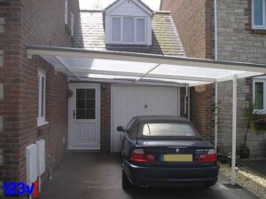traditional-white-carport-in-front-of-bmw-garage