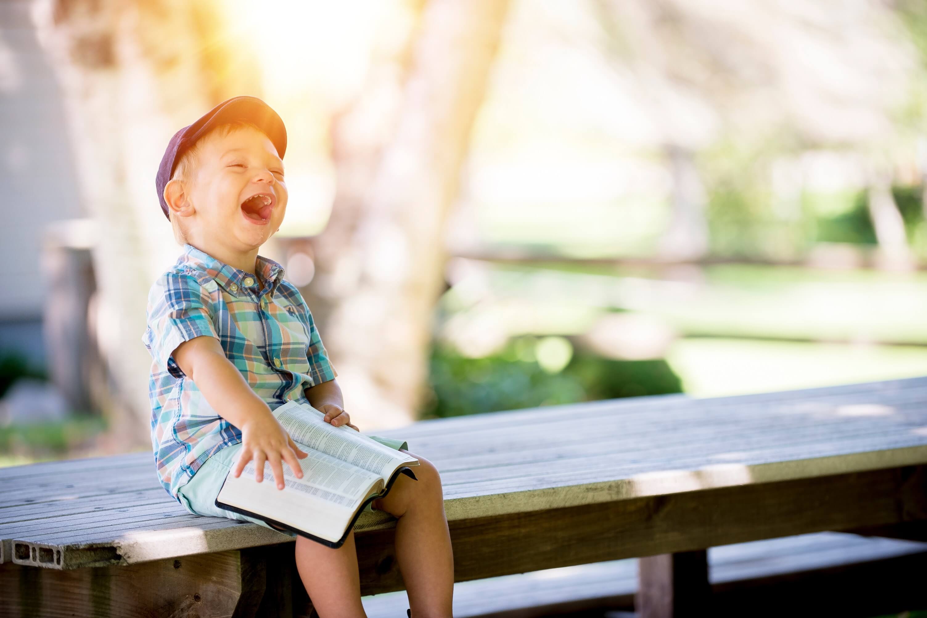 child laughing in the sun