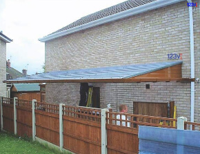Brown Cantilever Carport in Bedfordshire